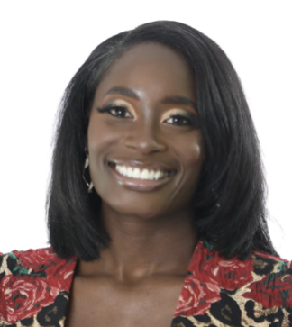A woman with shoulder-length hair smiles warmly while wearing a patterned jacket with red and gold floral accents against a white background.