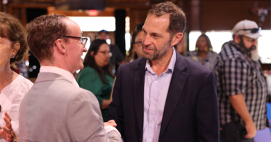 Attendees speak with recruiters and explore career opportunities during Congressman Jason Crow's annual job fair in Aurora, where more than 60 employers and community organizations connected with job seekers from across the region.
