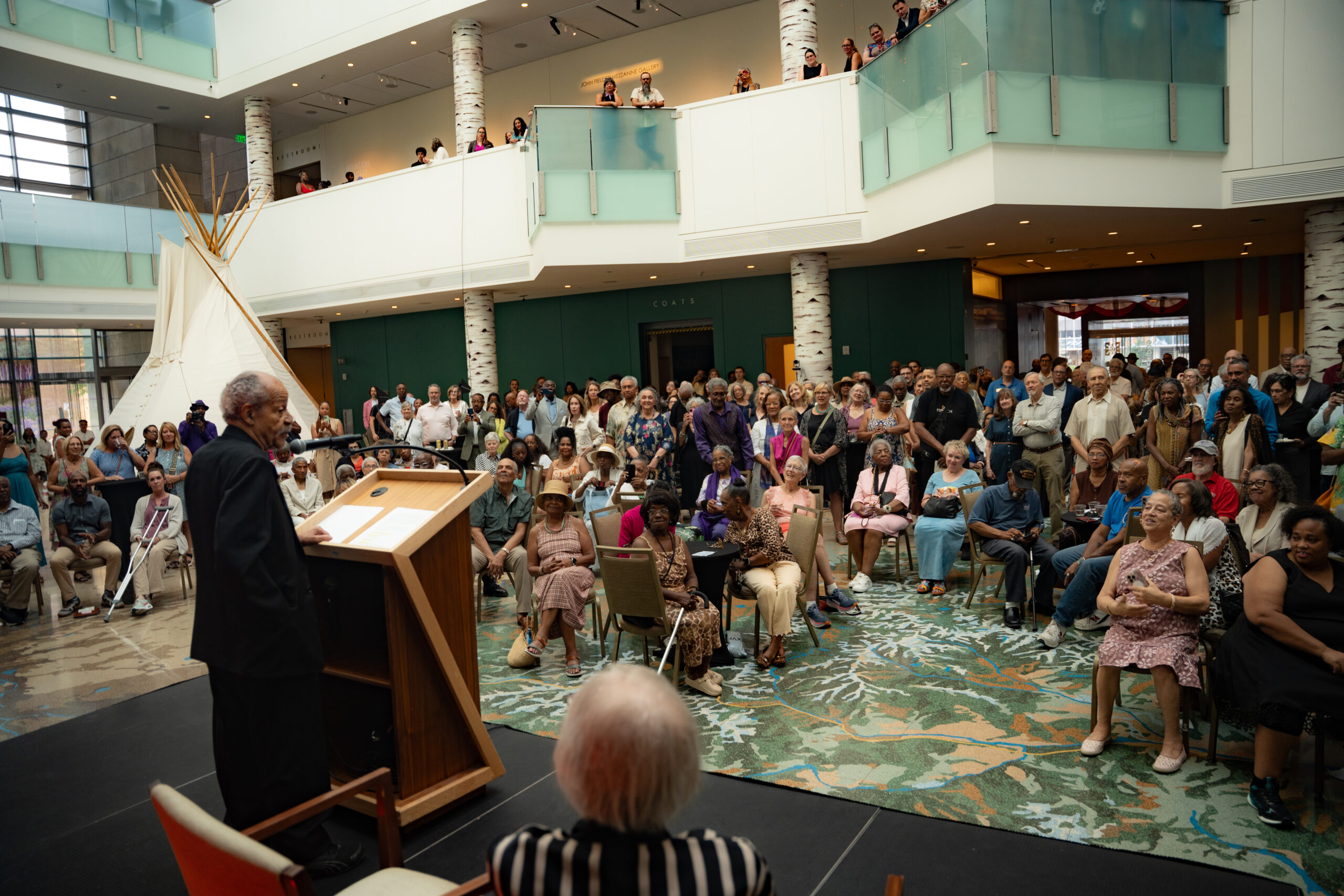 Artist Ed Dwight addresses guests during the opening celebration for "Ed Dwight: Casting a Legacy" at History Colorado Center.
