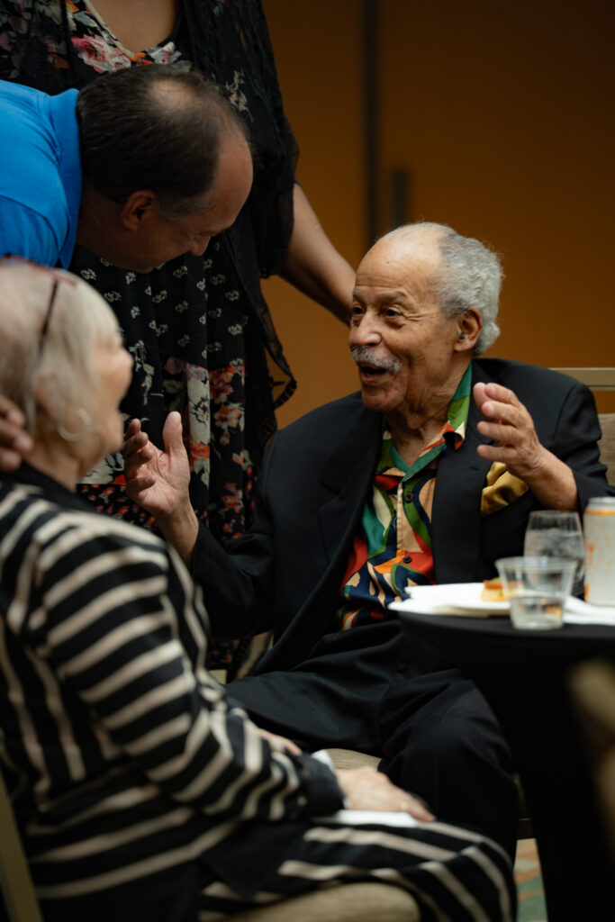 Artist Ed Dwight speaks with attendees during the opening reception for "Ed Dwight: Casting a Legacy" at History Colorado Center.
