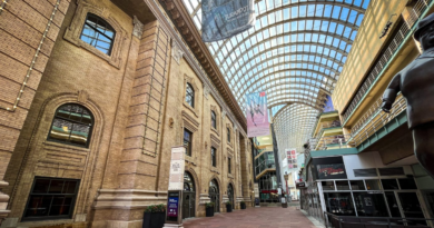 The Denver Performing Arts Complex’s covered Galleria walkway, with the Ellie Caulkins Opera House and Garner Galleria Theatre visible beneath the glass canopy.
