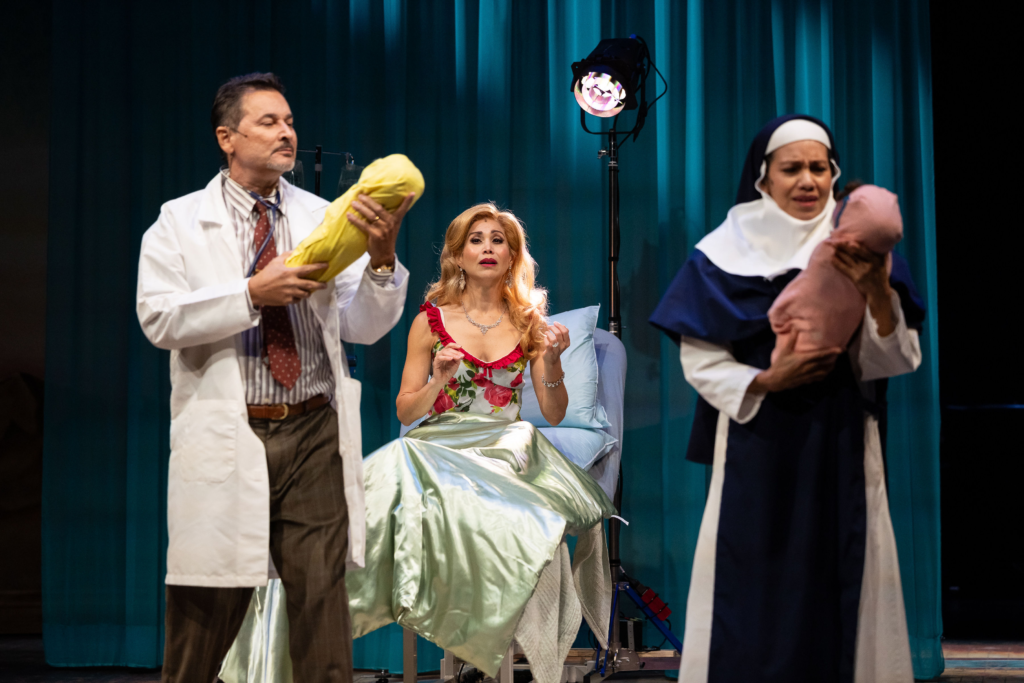 Al Rodrigo, Bianca Marroquín and Cheryl Umaña perform a hospital scene in Destiny of Desire, with two swaddled infants onstage.