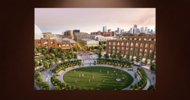 Architectural rendering of a proposed mixed-use development near Denver’s Burnham Yard, featuring a landscaped public park, pedestrian walkways, residential buildings and the downtown Denver skyline.