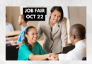 Job fair graphic featuring three diverse professionals at a recruitment meeting. A smiling woman in a teal blouse shakes hands with a man across a table while another woman in a beige blazer looks on. Text reads “Job Fair Oct 22.”